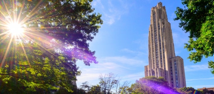 Cathedral of Learning with bright sun rays shining down