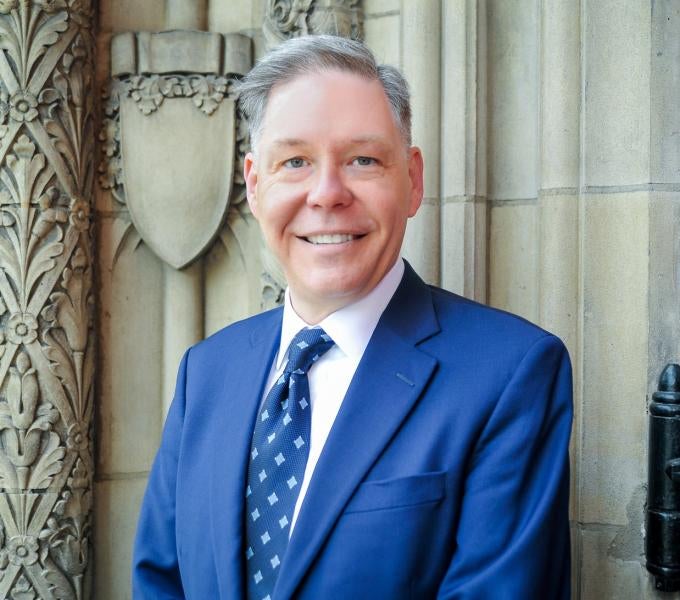 Photo of Jonahtan Helm in front of Heinz chapel