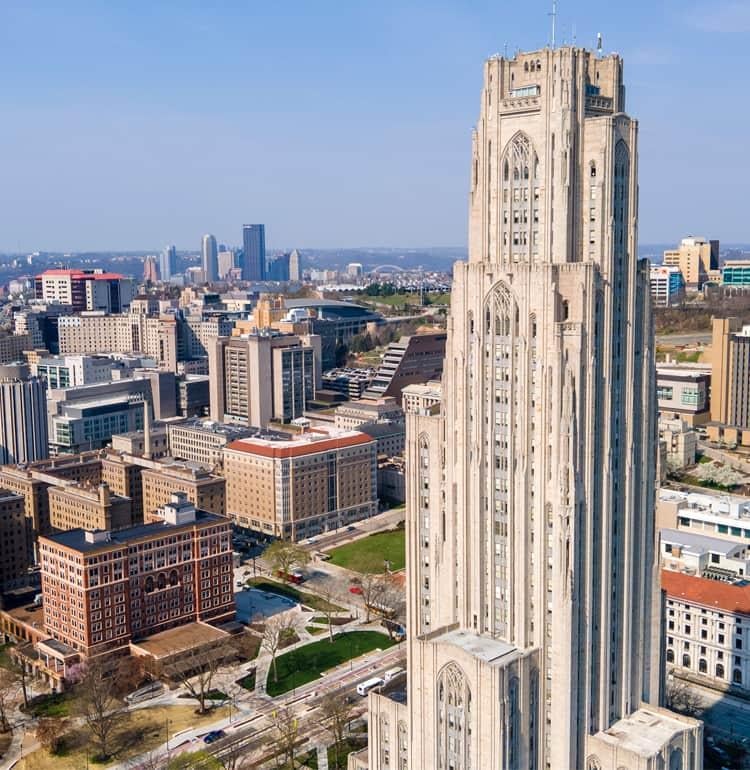 The Cathedral of Learning with the city of Pittsburgh in the background.